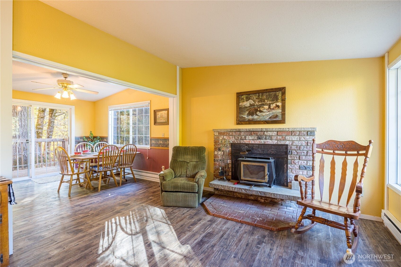 2095 Bear Creek Road Port Angeles, WA 98363 - Photo 4 of 39 a living room with furniture wooden floor and a fireplace
