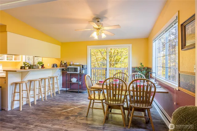 a view of a dining room with furniture window and wooden floor