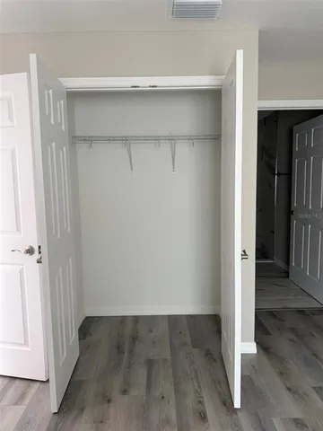 an empty room with wooden floor