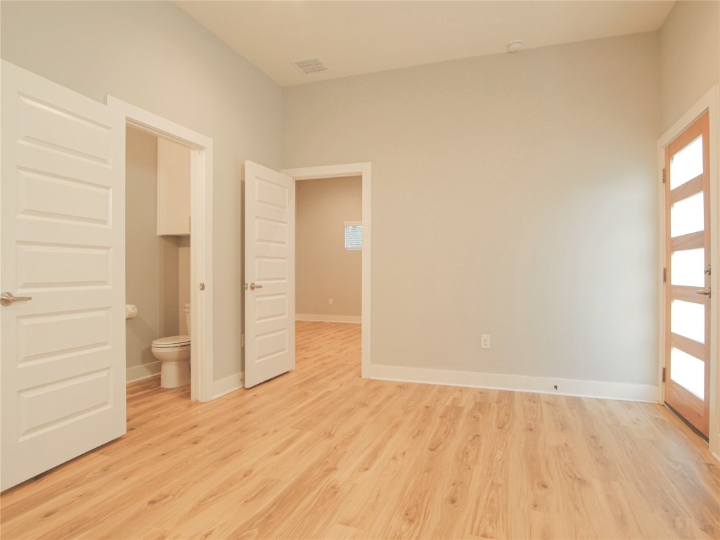 6014 Fairway Street, Unit 2 Austin, TX 78741 - Photo 12 of 24 wooden floor in an empty room