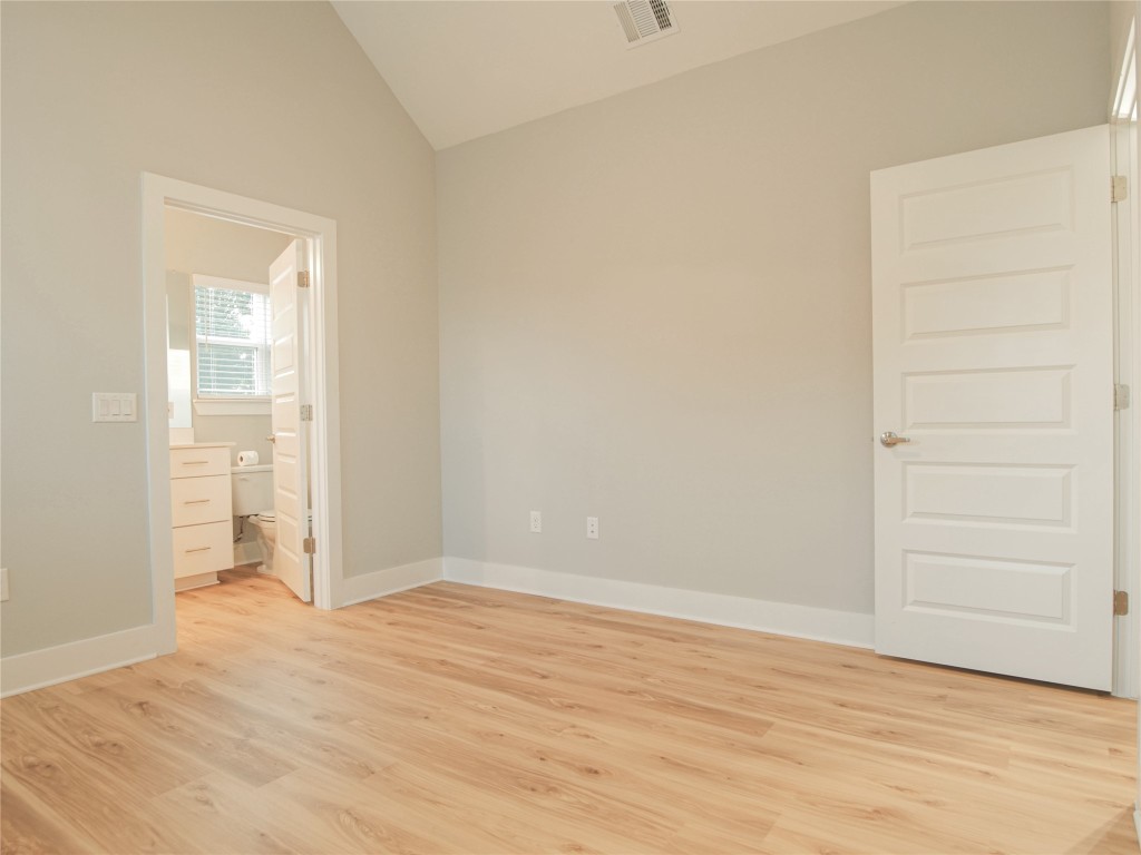 6014 Fairway Street, Unit 2 Austin, TX 78741 - Photo 17 of 24 wooden floor and cabinet in a room
