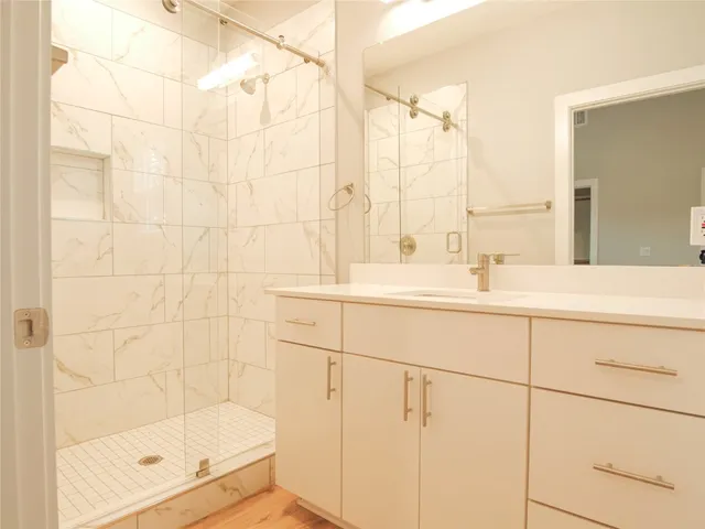 a bathroom with a sink a toilet and a window