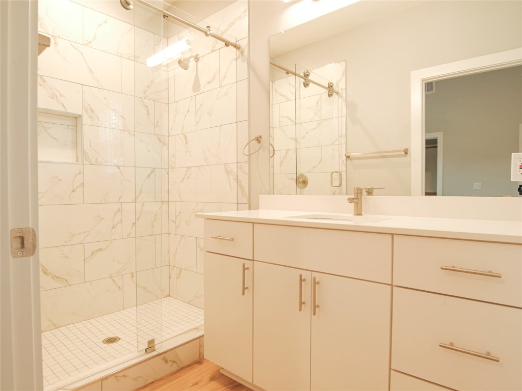 6014 Fairway Street, Unit 2 Austin, TX 78741 - Photo 18 of 24 a bathroom with a shower and a sink