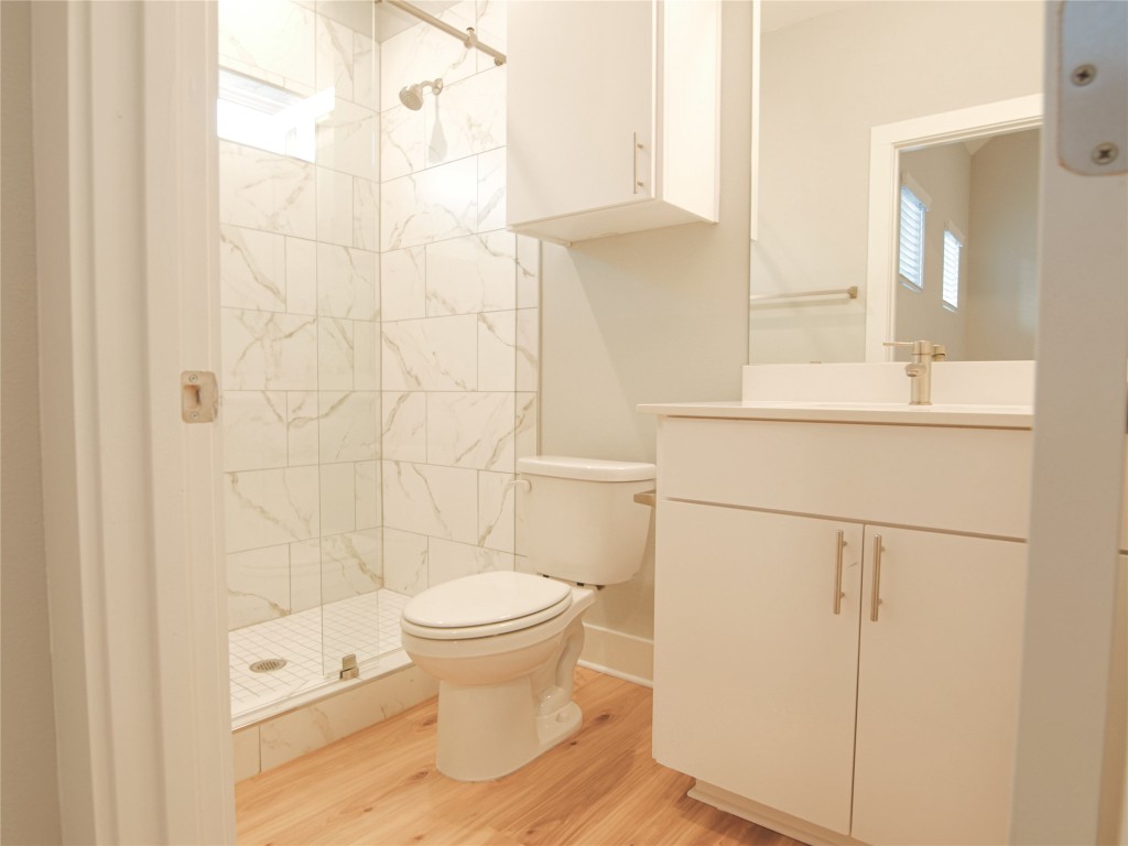 6014 Fairway Street, Unit 2 Austin, TX 78741 - Photo 22 of 24 a bathroom with a toilet and a shower