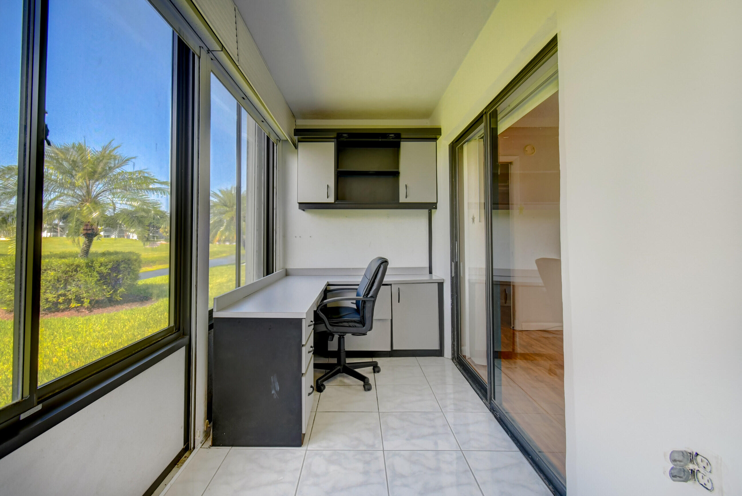 61 Capri B Delray Beach, FL 33484 - Photo 30 of 46 a view of a workspace with furniture and a window