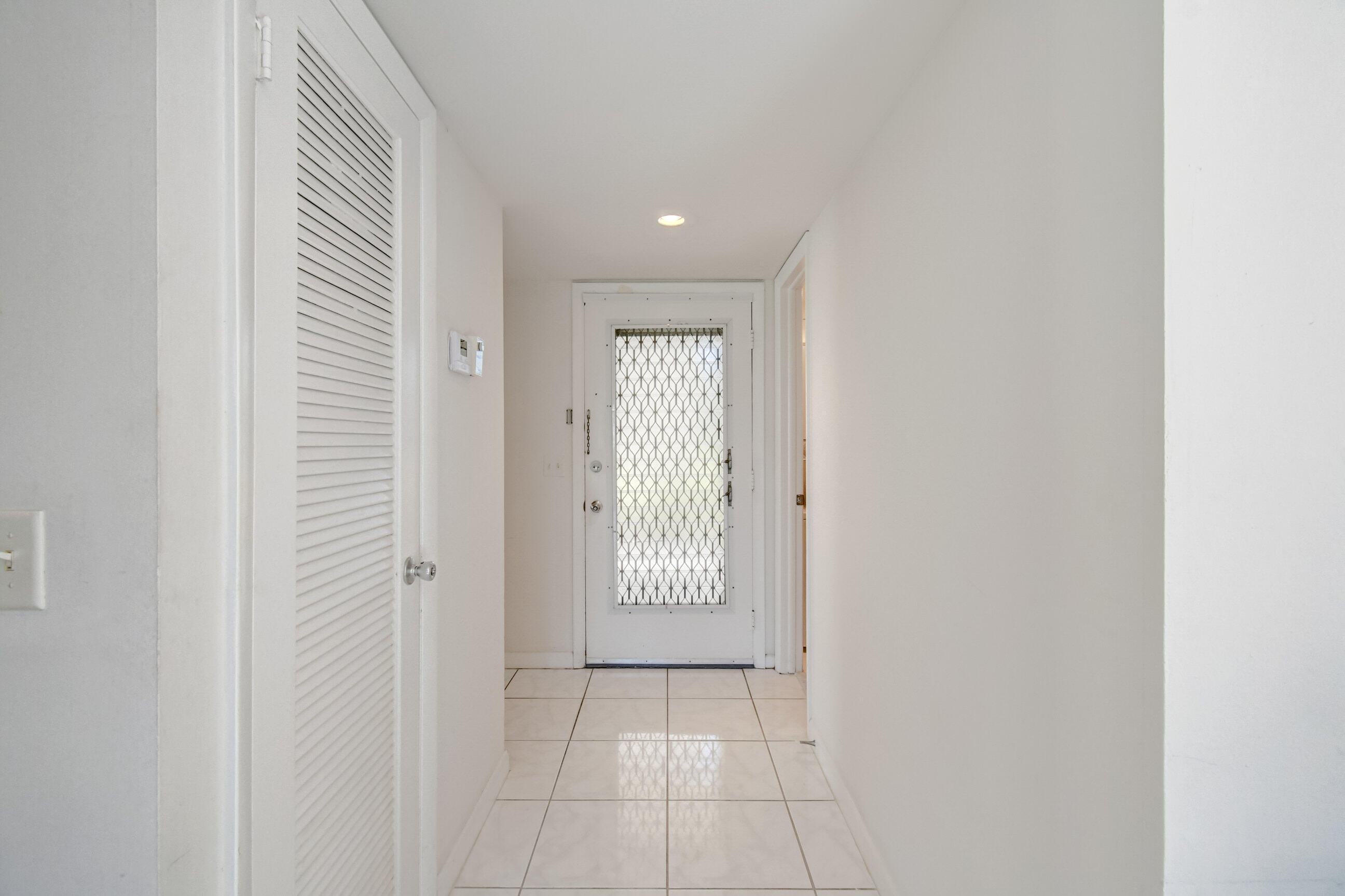 61 Capri B Delray Beach, FL 33484 - Photo 3 of 46 a view of a hallway with door
