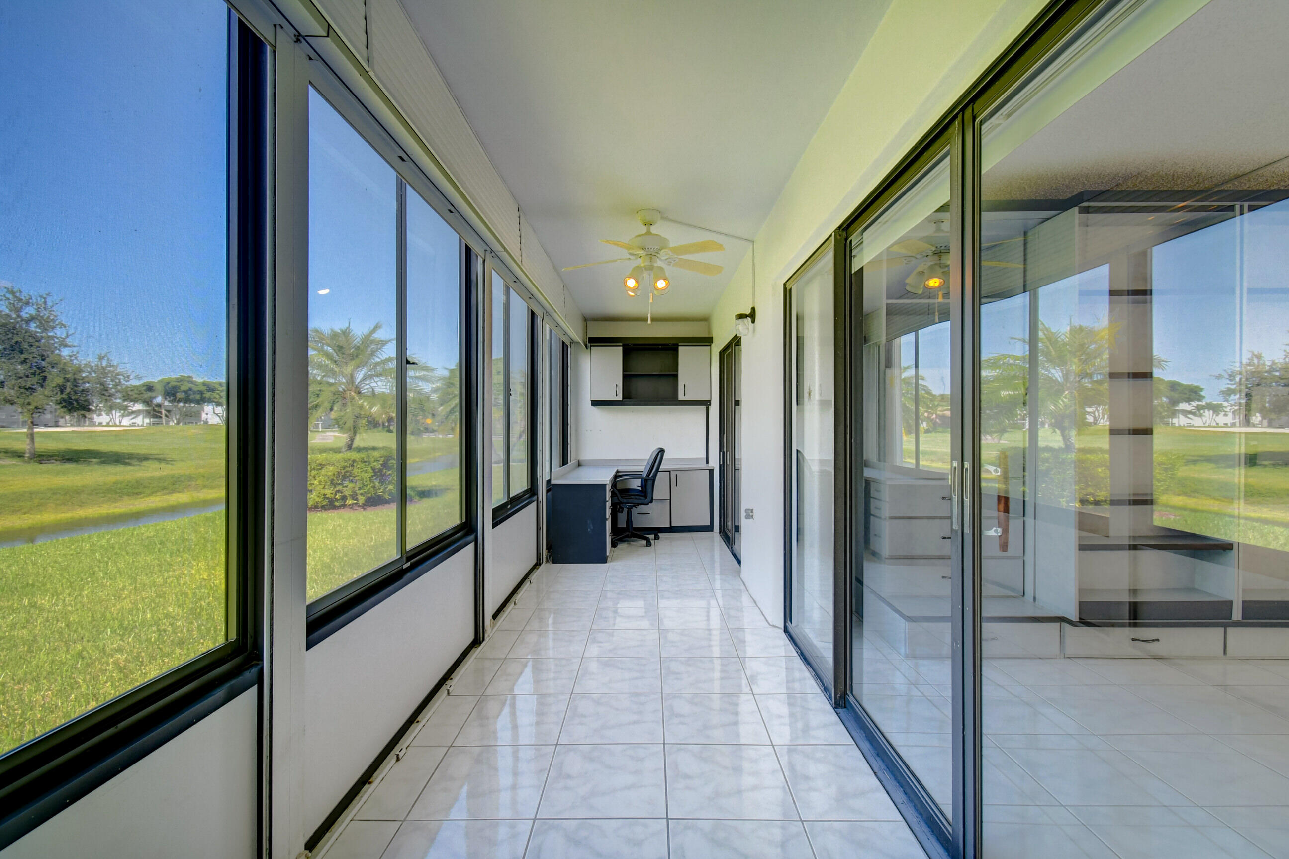 61 Capri B Delray Beach, FL 33484 - Photo 32 of 46 a bathroom with a glass door and shower