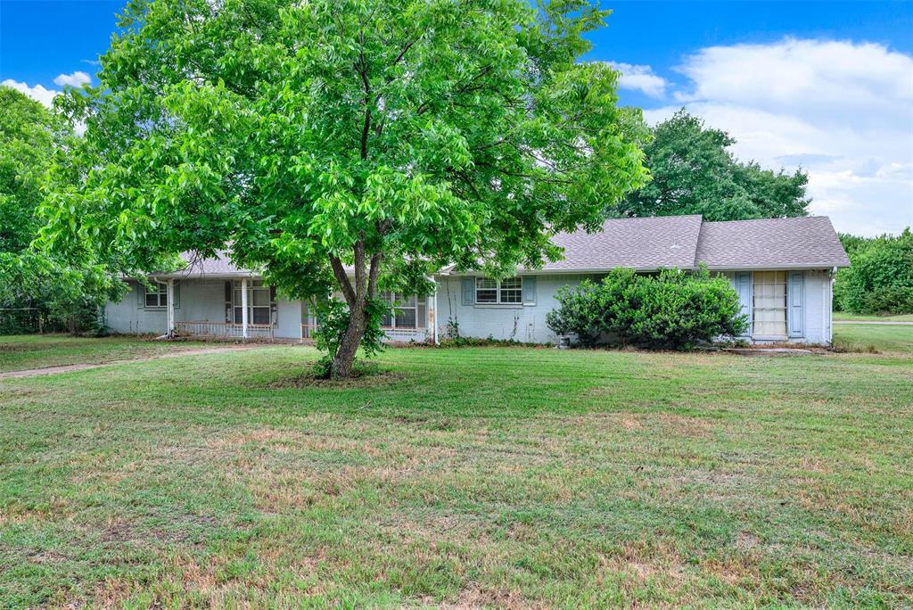 1415 South Joe Wilson Road Cedar Hill, TX 75104 - Photo 1 of 17 a view of a house with yard and a garden