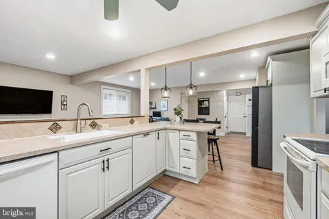 a kitchen with a sink and cabinets