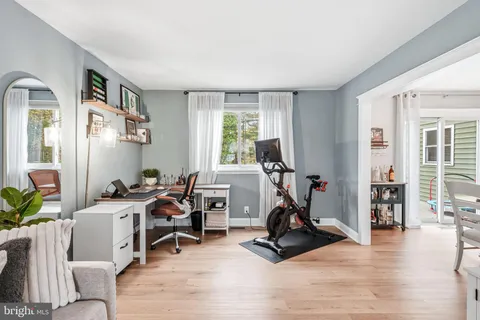 a view of a livingroom with furniture and a window
