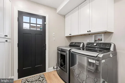 a kitchen with stainless steel appliances granite countertop a stove and a refrigerator