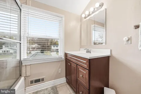 a bathroom with a sink and a vanity