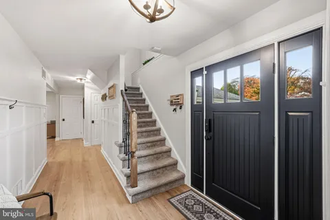 a view of entryway with wooden floor and window