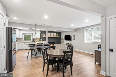 a view of a dining room with furniture and wooden floor