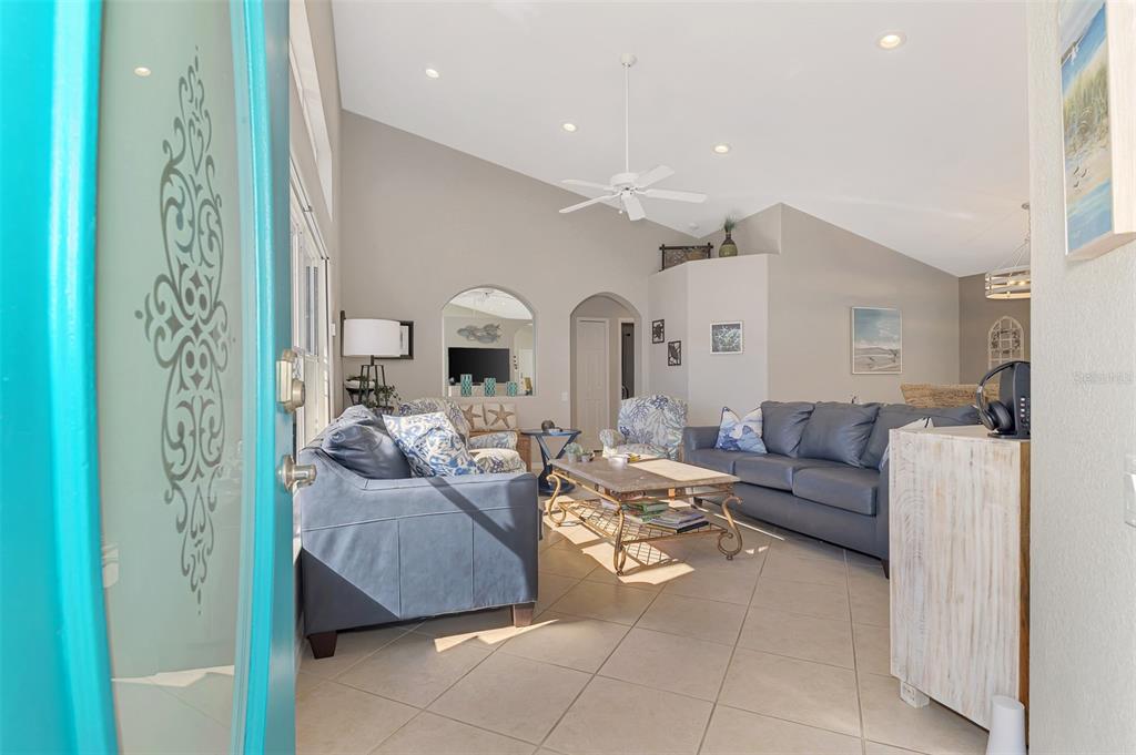 335 St George Court, Unit 1 Venice, FL 34293 - Photo 18 of 87 a living room with furniture and a fireplace