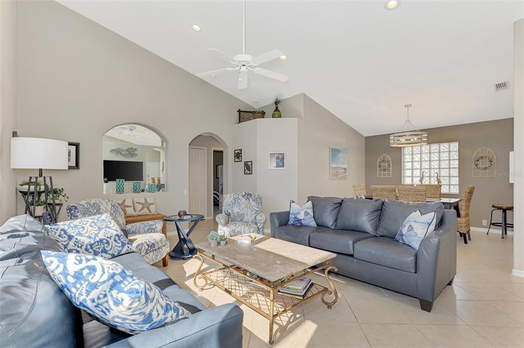 335 St George Court, Unit 1 Venice, FL 34293 - Photo 19 of 87 a living room with furniture and a wooden floor