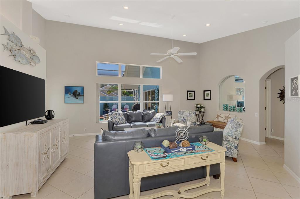 335 St George Court, Unit 1 Venice, FL 34293 - Photo 20 of 87 a living room with furniture a window and a flat screen tv