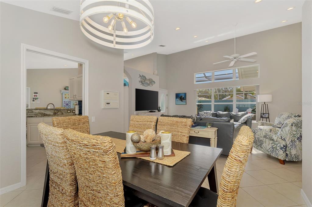 335 St George Court, Unit 1 Venice, FL 34293 - Photo 26 of 87 a living room with furniture and a large window