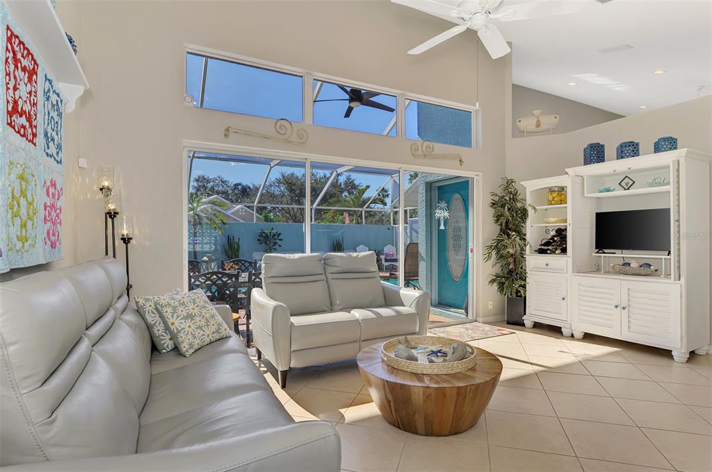 335 St George Court, Unit 1 Venice, FL 34293 - Photo 36 of 87 a living room with furniture and a flat screen tv