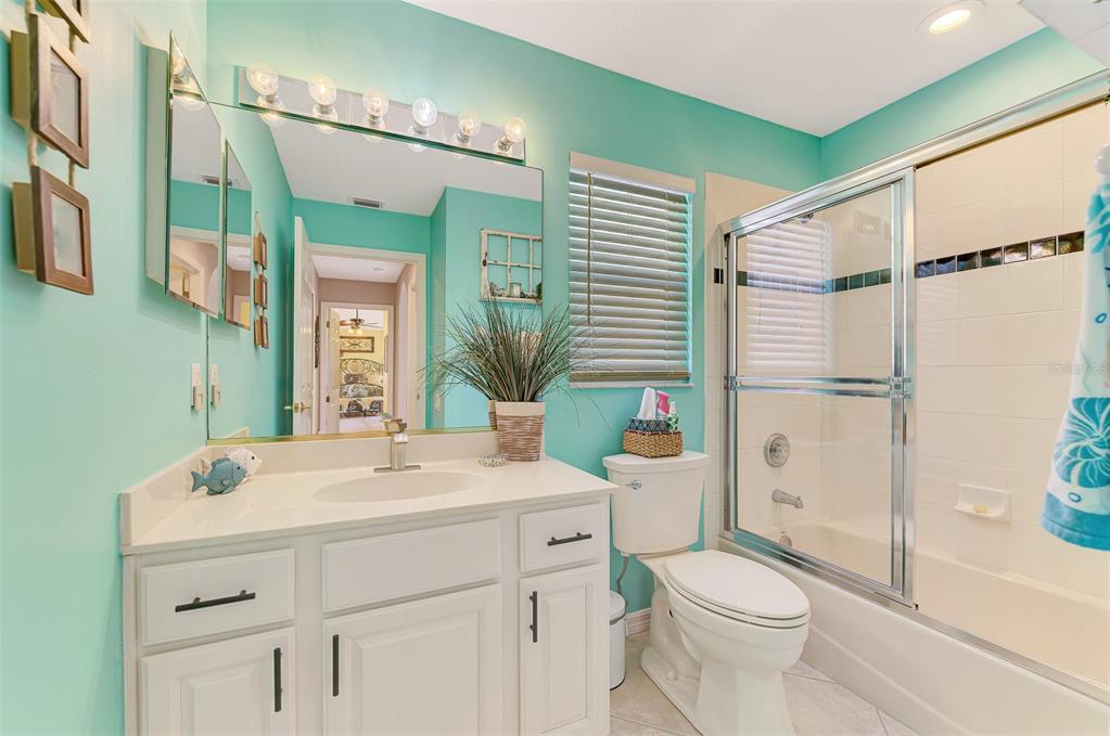 335 St George Court, Unit 1 Venice, FL 34293 - Photo 47 of 87 a bathroom with a sink a toilet and shower