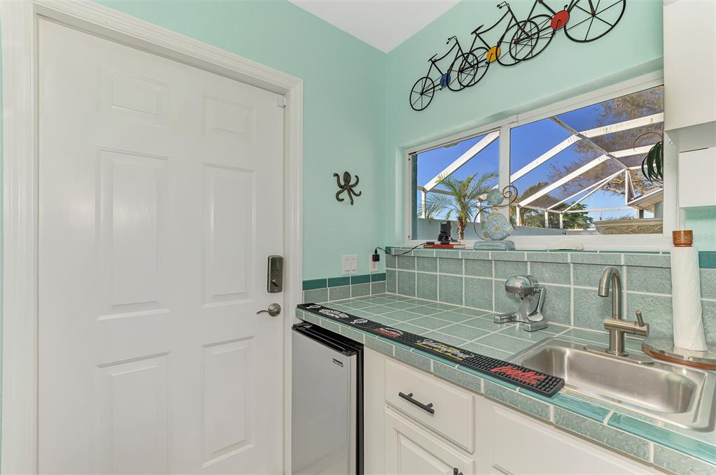 335 St George Court, Unit 1 Venice, FL 34293 - Photo 53 of 87 a bathroom with a sink and a mirror