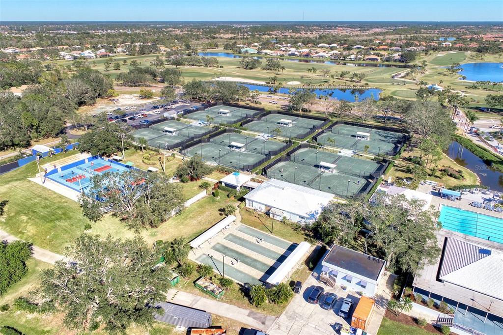 335 St George Court, Unit 1 Venice, FL 34293 - Photo 61 of 87 an aerial view of residential building with parking space