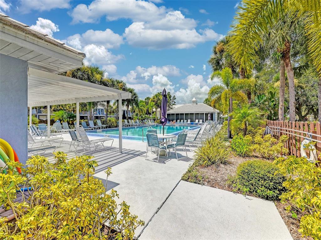 335 St George Court, Unit 1 Venice, FL 34293 - Photo 68 of 87 a view of a swimming pool with a patio