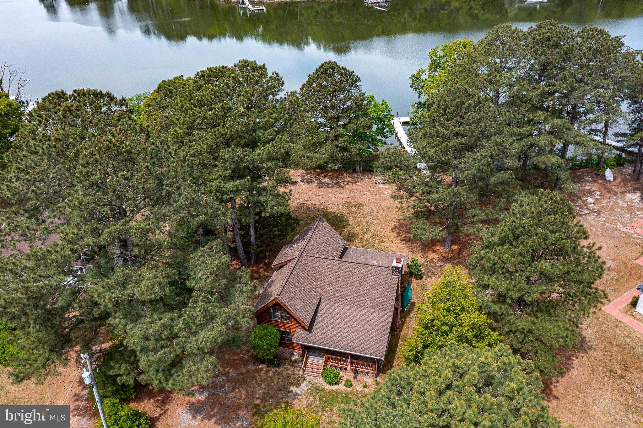an aerial view of a house with a lake view