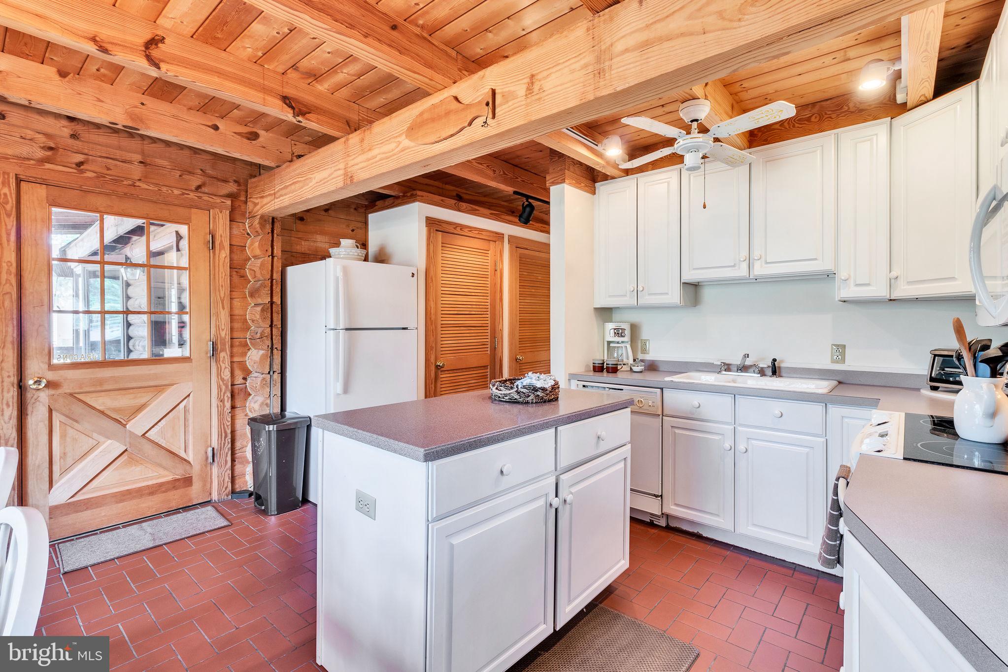 1280 Kelley Neck Road Lancaster, VA 22503 - Photo 21 of 51 a kitchen that has a cabinets counter space and a stove