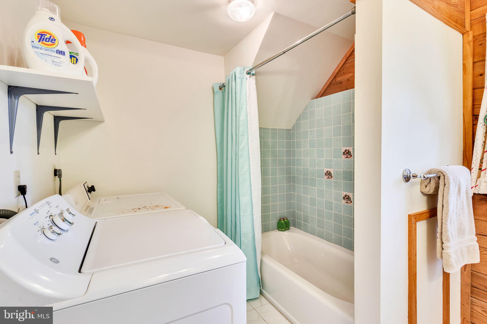 1280 Kelley Neck Road Lancaster, VA 22503 - Photo 28 of 51 a bathroom with a tub and shower