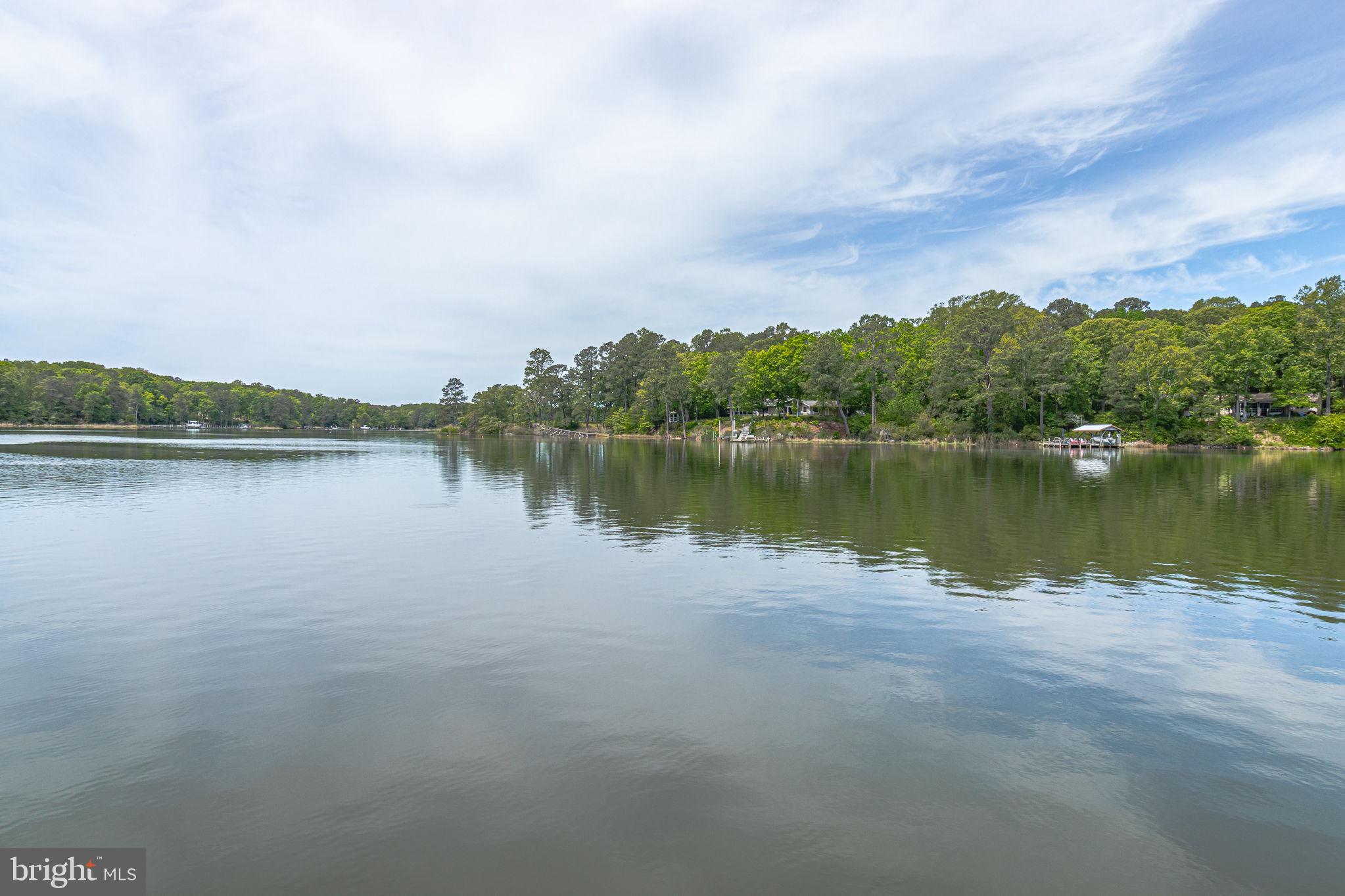 1280 Kelley Neck Road Lancaster, VA 22503 - Photo 48 of 51 a view of a lake with houses in the back