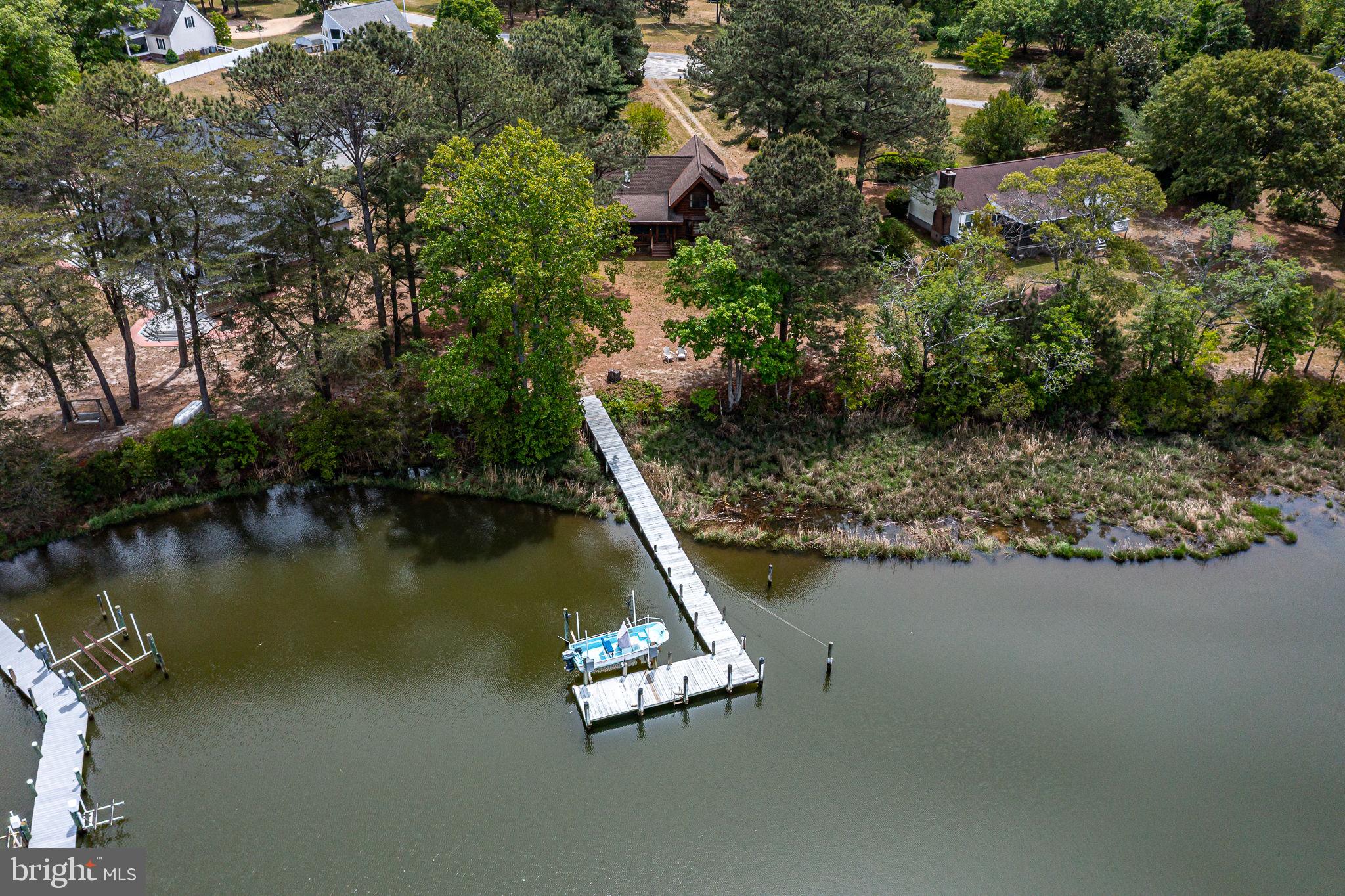 1280 Kelley Neck Road Lancaster, VA 22503 - Photo 49 of 51 an aerial view of a house with a lake view