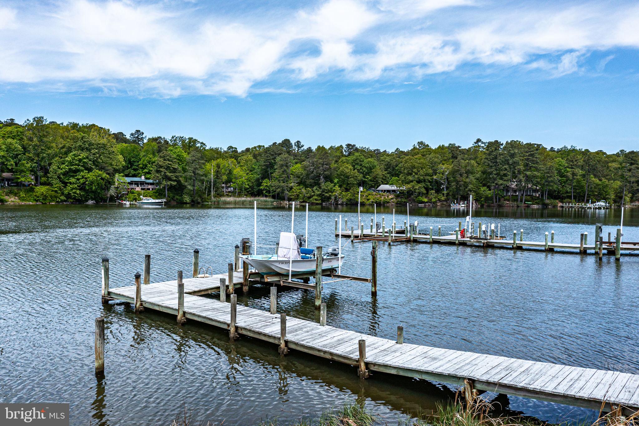 1280 Kelley Neck Road Lancaster, VA 22503 - Photo 6 of 51 a view of a lake with sitting area