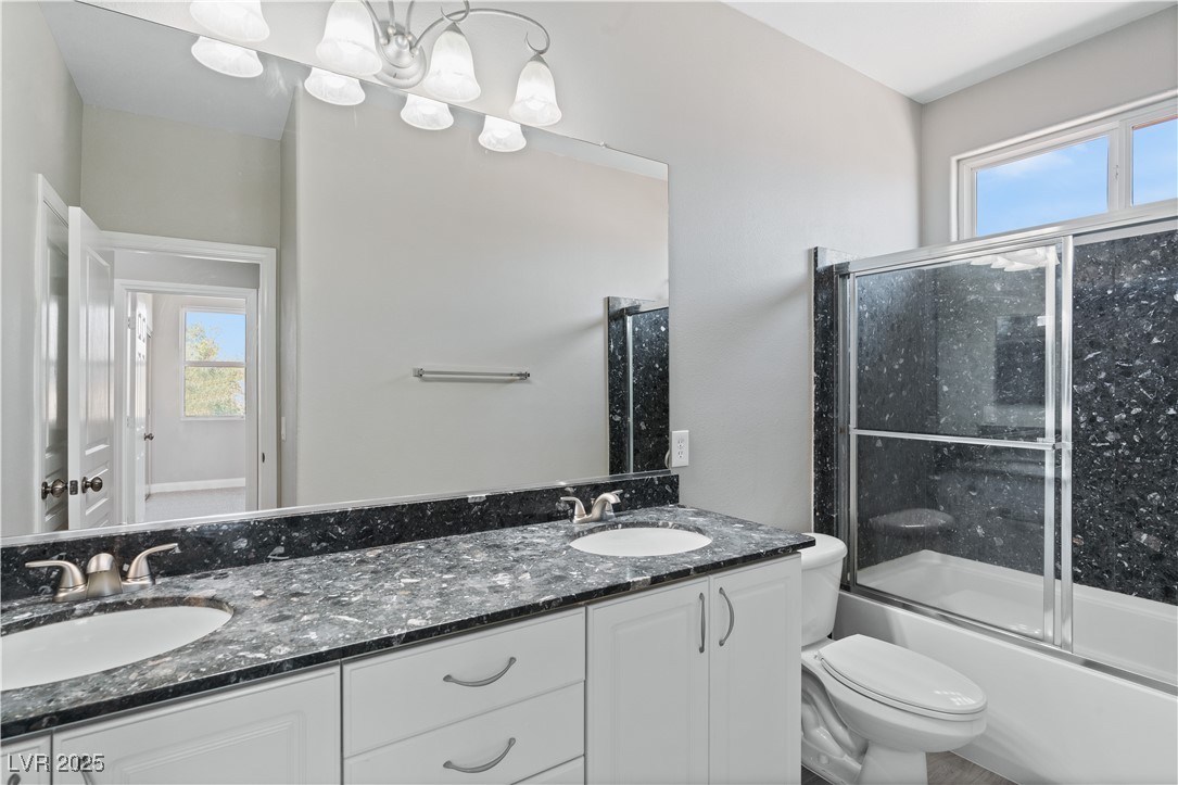 312 Pocono Ranch Avenue North Las Vegas, NV 89031 - Photo 28 of 34 Full bathroom with a wealth of natural light, toilet, and a sink
