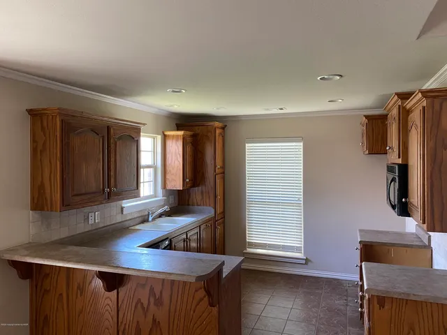 a bathroom with a sink and a window