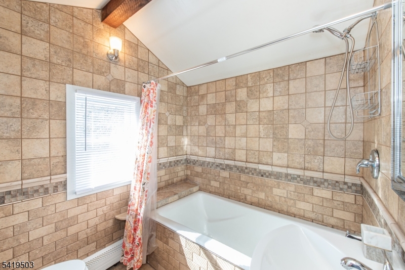 40 Kingsland Road West Milford, NJ 07421 - Photo 14 of 20 a bathroom with a bathtub and shower