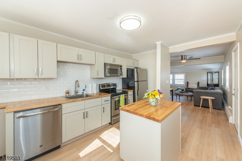 40 Kingsland Road West Milford, NJ 07421 - Photo 6 of 20 a kitchen that has a lot of cabinets in it and appliances