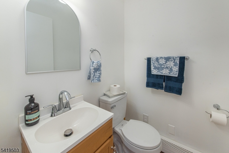 40 Kingsland Road West Milford, NJ 07421 - Photo 9 of 20 a bathroom with a sink a toilet and mirror
