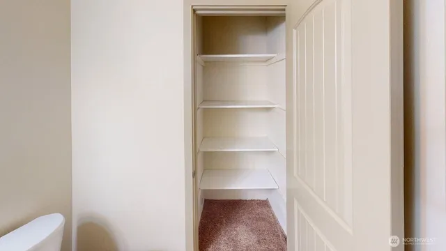 a view of an empty walk in closet