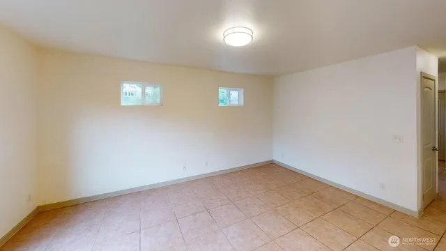 an empty room with a empty space and window