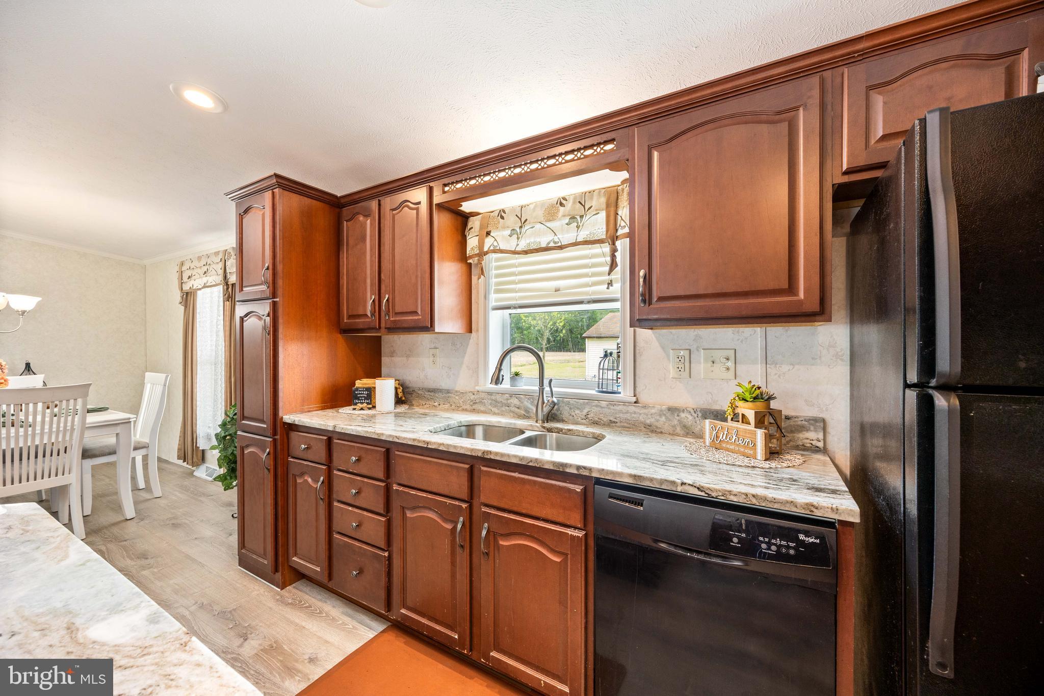 4258 Smith Road Salisbury, MD 21801 - Photo 21 of 43 a kitchen with a sink appliances cabinets and furniture