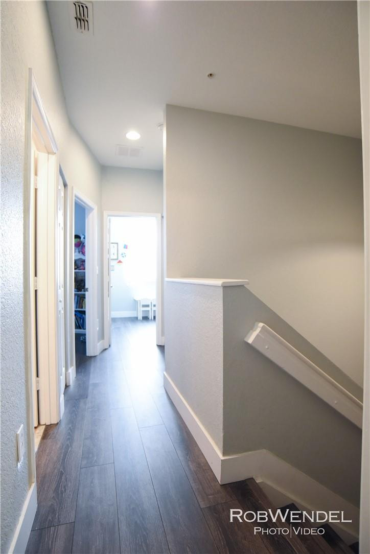 2851 Prospect Road, Unit 405 Tamarac, FL 33309 - Photo 11 of 25 a view of hallway with stairs and wooden floor
