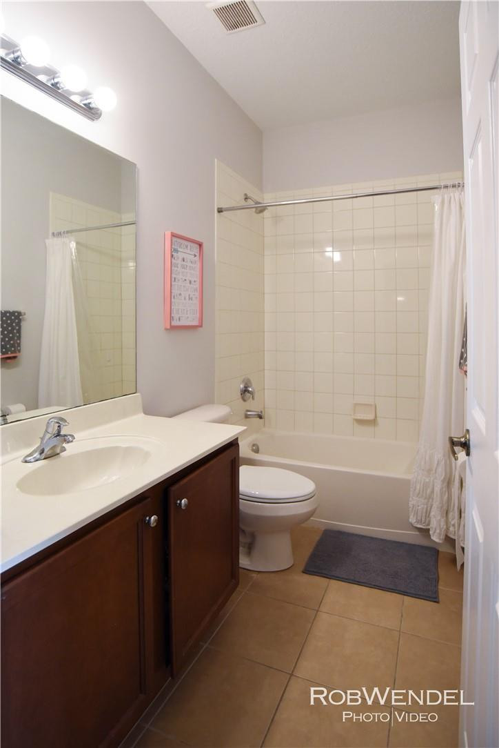 2851 Prospect Road, Unit 405 Tamarac, FL 33309 - Photo 12 of 25 a bathroom with a sink a toilet and shower