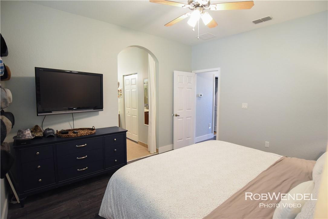 2851 Prospect Road, Unit 405 Tamarac, FL 33309 - Photo 18 of 25 a bedroom with a bed and a flat screen tv