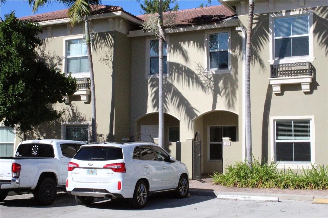2851 Prospect Road, Unit 405 Tamarac, FL 33309 - Photo 21 of 25 a view of a cars park in front of a building
