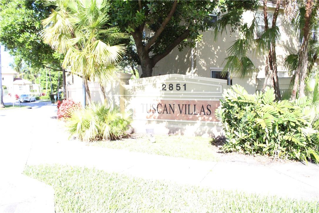 2851 Prospect Road, Unit 405 Tamarac, FL 33309 - Photo 24 of 25 a sign on the side of a road
