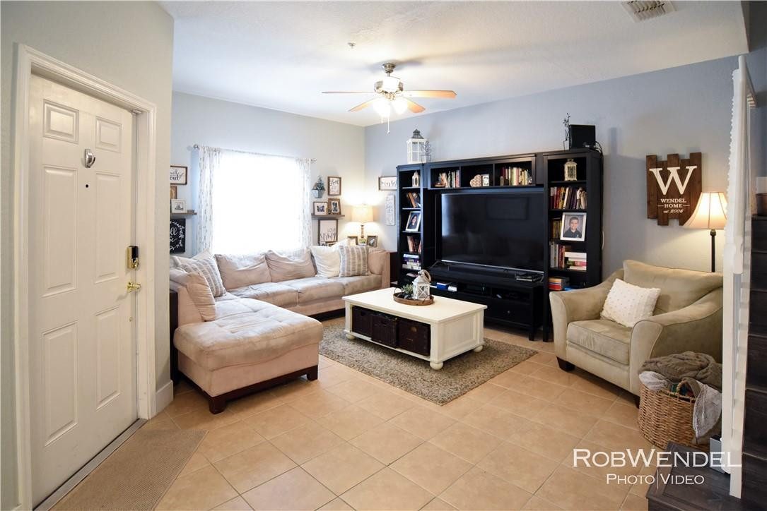 2851 Prospect Road, Unit 405 Tamarac, FL 33309 - Photo 3 of 25 a living room with furniture and a flat screen tv