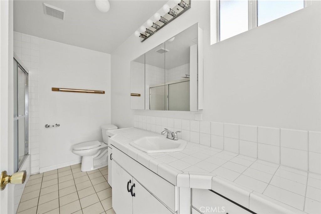 10528 1/2 Hillhaven Avenue Tujunga, CA 91042 - Photo 11 of 28 a bathroom with a sink toilet and shower