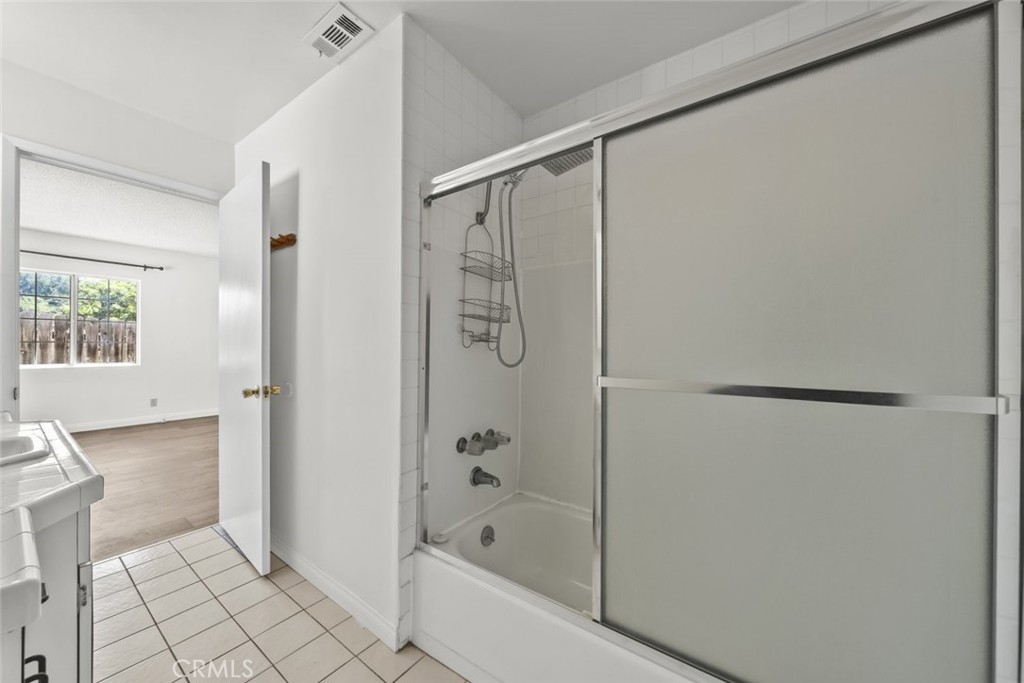 10528 1/2 Hillhaven Avenue Tujunga, CA 91042 - Photo 12 of 28 a bathroom with a bathtub and a shower