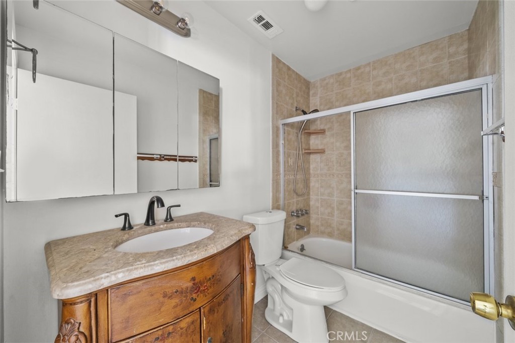 10528 1/2 Hillhaven Avenue Tujunga, CA 91042 - Photo 20 of 28 a bathroom with a granite countertop sink toilet and shower